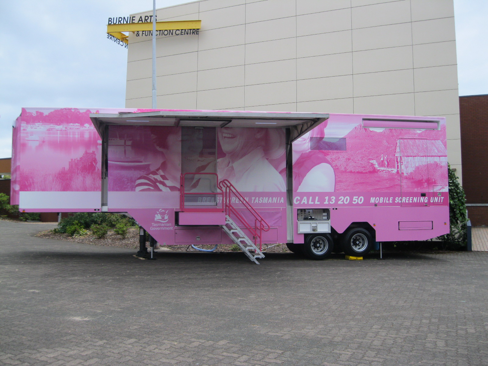 A photo of the pink mobile unit on location for BreastScreen Tasmania.