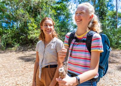 Two teenage girls bushwalking.