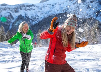 Two women playing in the snow