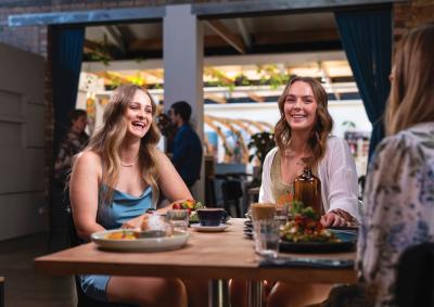 Three women eating in a cafe