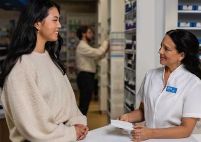 Woman talking with pharmacist