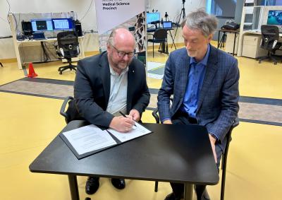 Dale Webster, Secretary DoH and Prof. Rufus Black from UTAS signing MoU