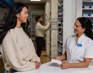 Woman talking with pharmacist