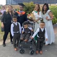 Janelle with Orion, Yordanos, and their children at a UTAS graduation ceremony in 2021. Orion and his family came to Tasmania from Eritrea and he has worked as a medical interpreter as well as completing further business studies at the University of Tasmania